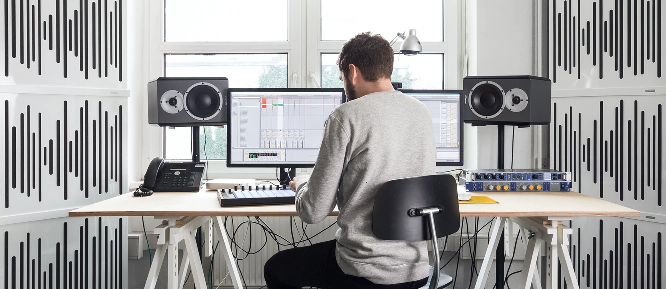 A man using a software to edit audio