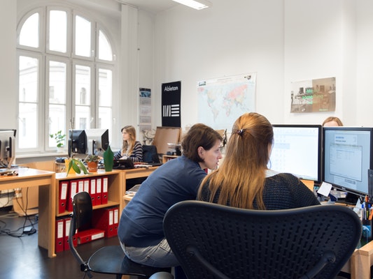 two persons working together